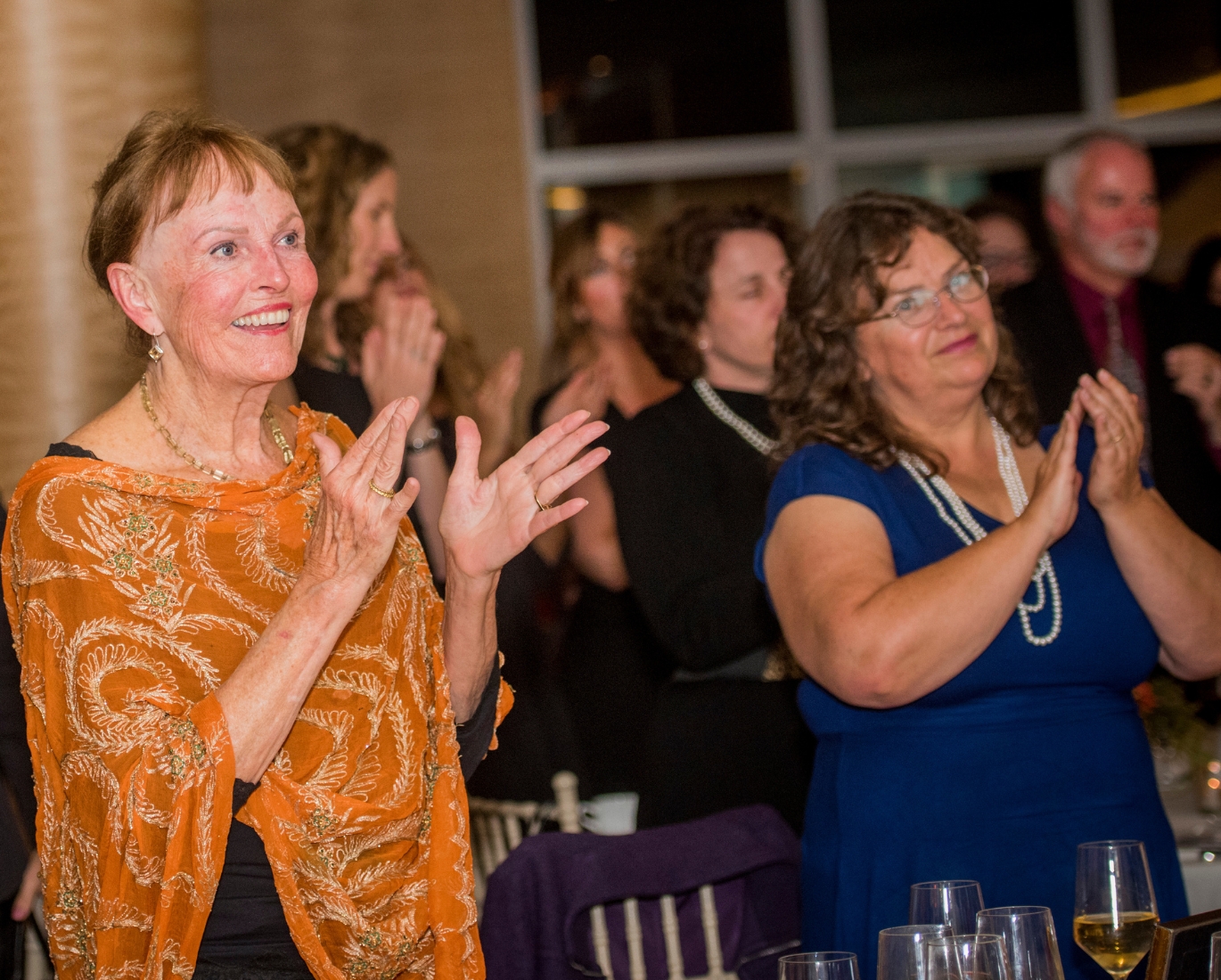 Tana Sommer, Legacy Society member, cheers in the audience at WEV’s 25th anniversary gala