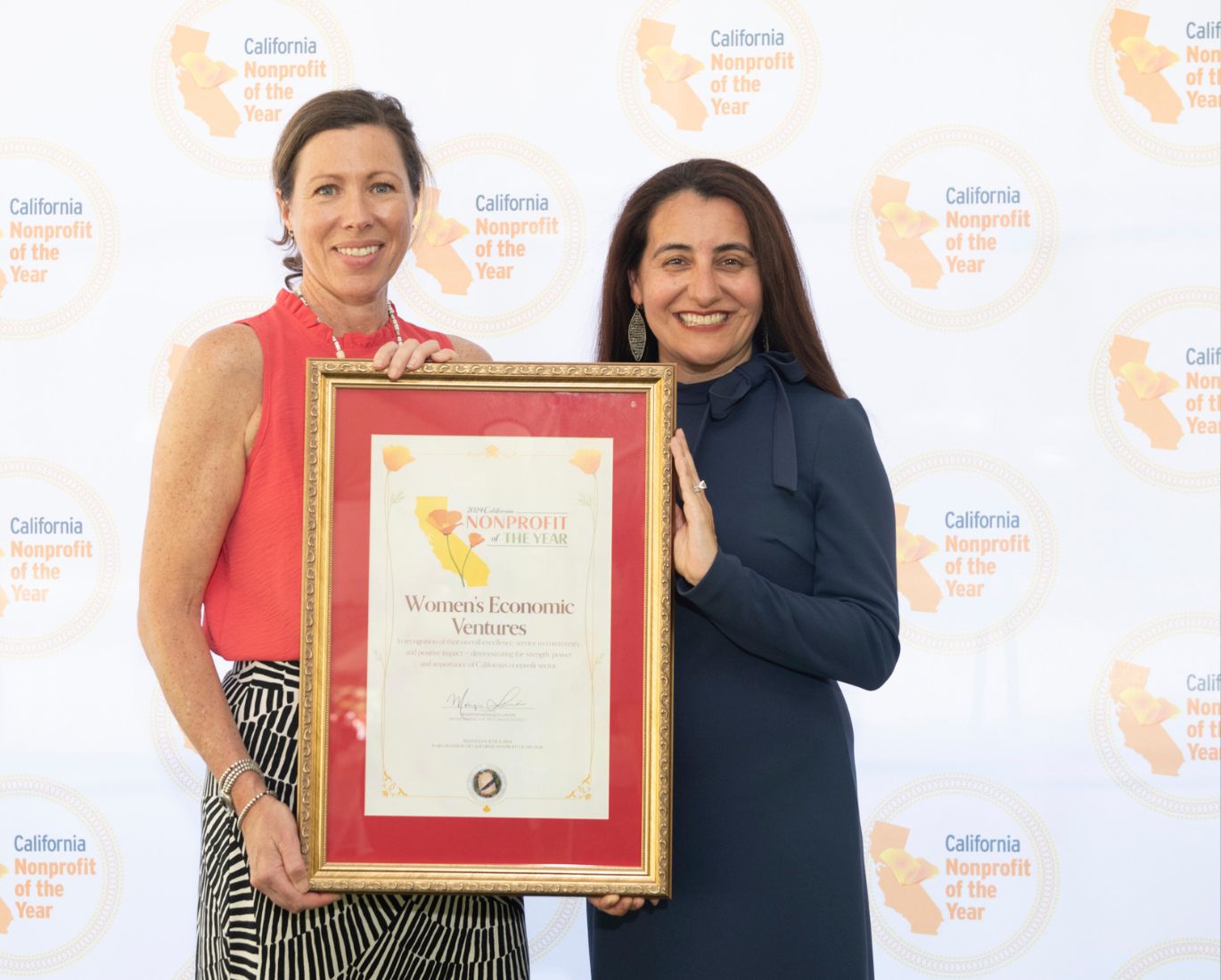WEV CEO Nicki Parr Receiving Award from State Senator Limón