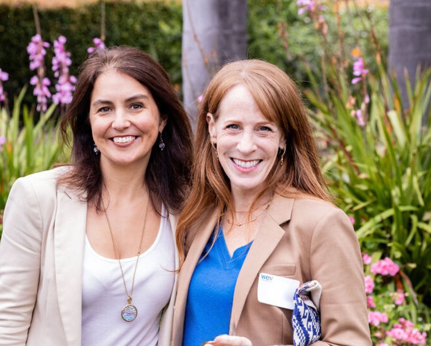 Two of WEV’s supporters smile for the camera at a WEV event